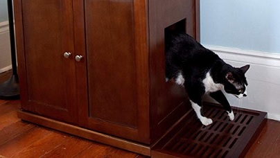 cat walking out of cat litter box furniture